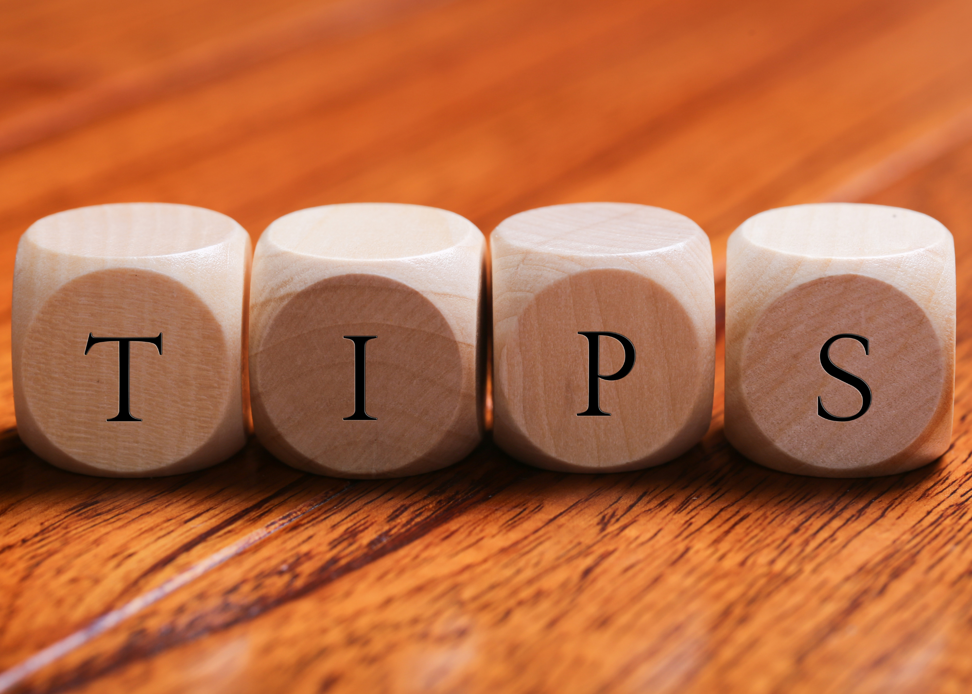 Wood blocks that spell the word "tips"